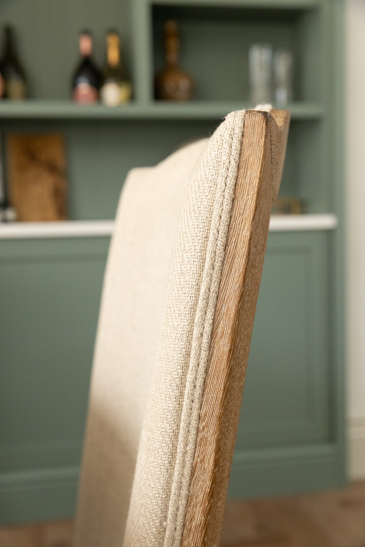 Natural linen chair back with oak frame, soft weave detail
