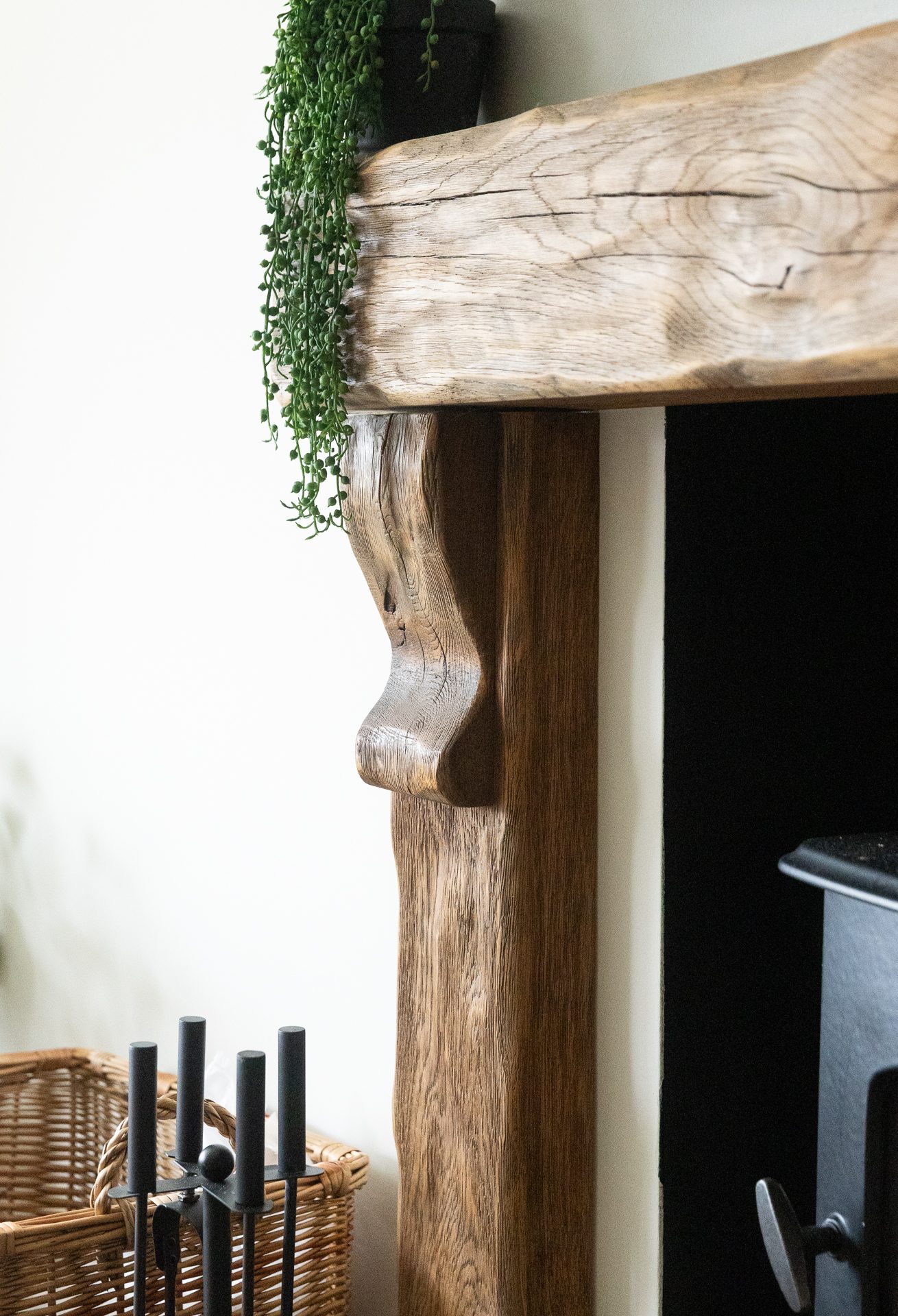 A reclaimed timber corbel mounted on the wall of the Bamburgh living room