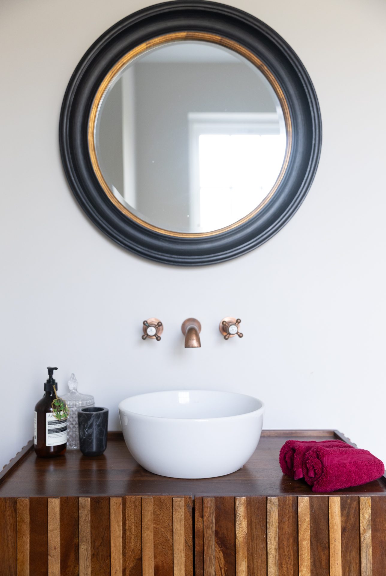 Dark timber vanity with copper tapware at Elmfield Road