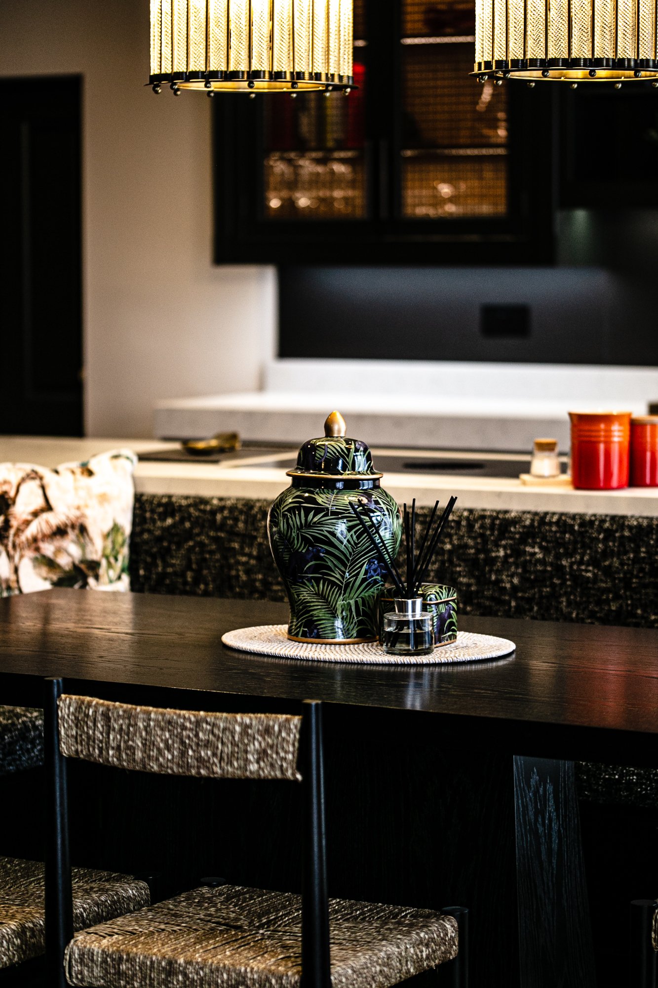 Detail of the kitchen worktop, styled with a vase, board and a ginger jar