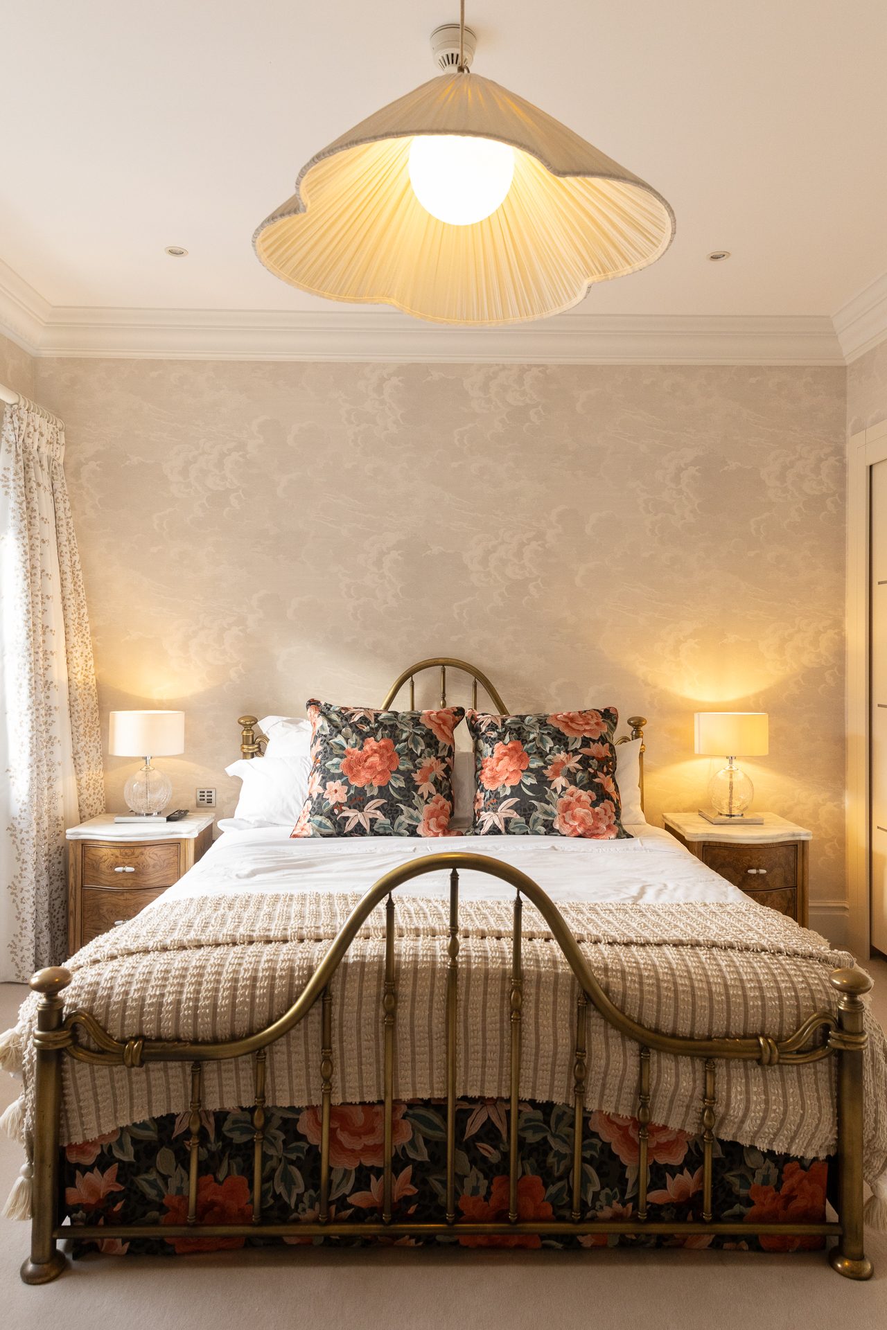 The Springfield master bedroom, shell pendant over a brass Victorian bed