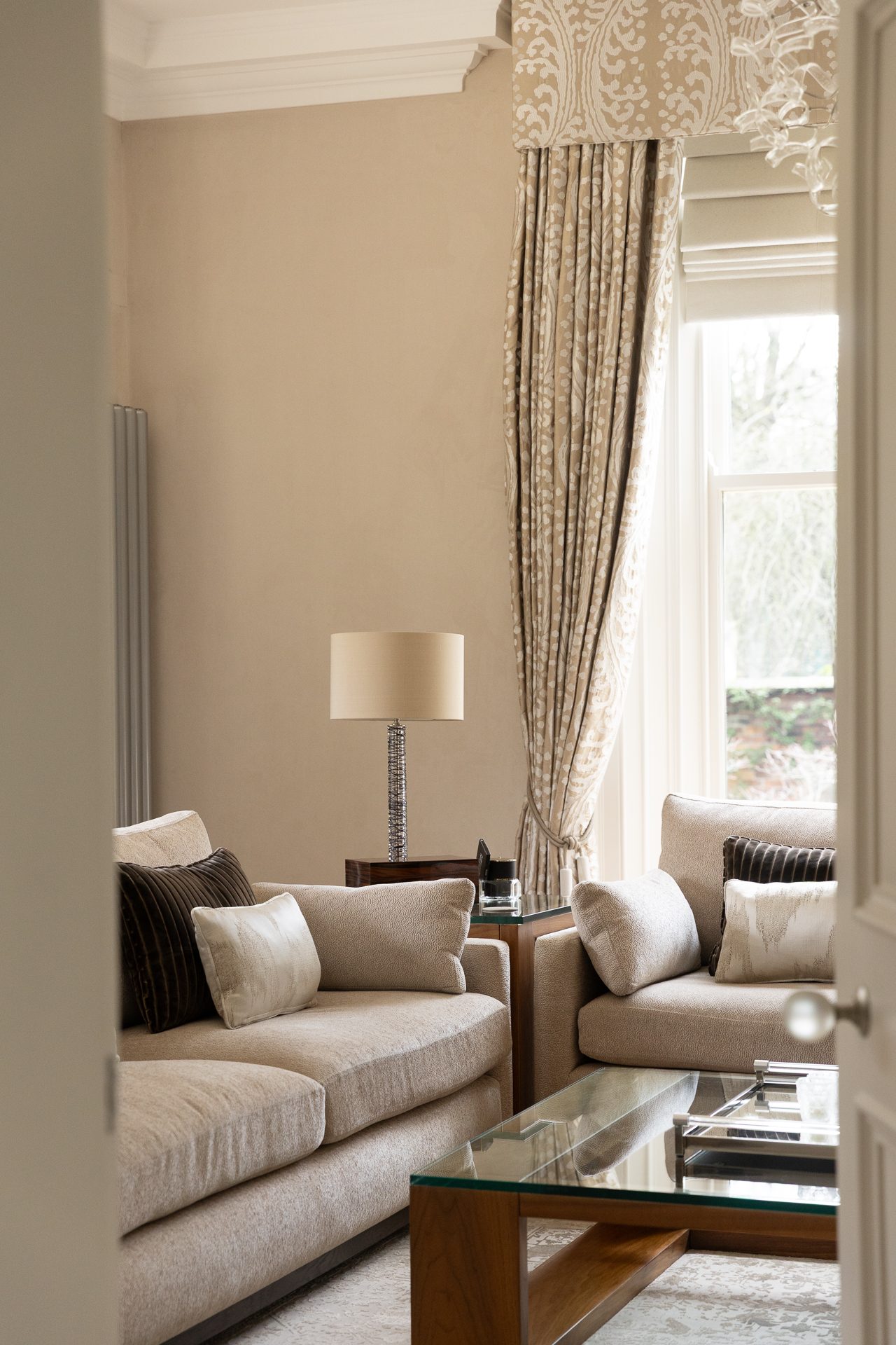 Springfield living room seating corner, textiles and table lamp in natural light