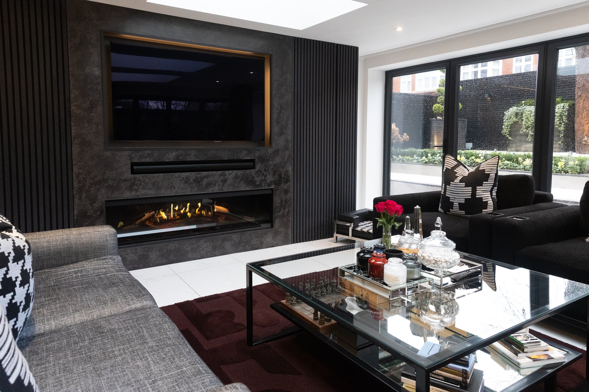 Sycamore project, dark slatted timber fireplace wall with horizontal linear fire